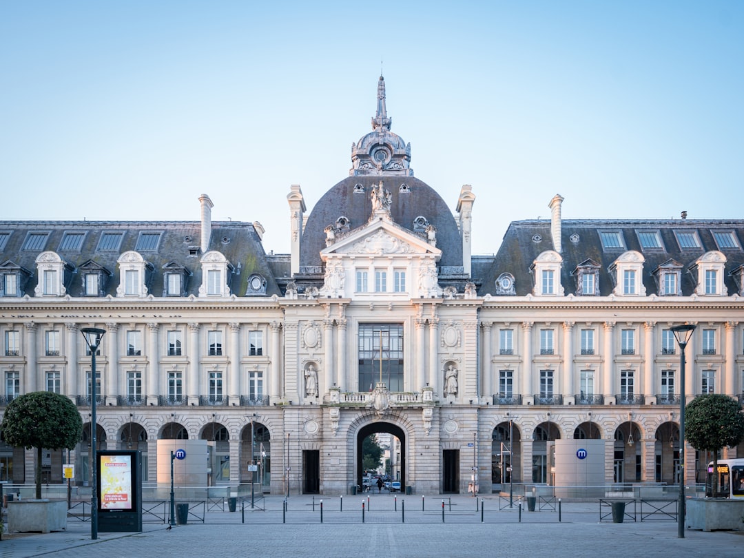 A large building with a clock tower in front of it